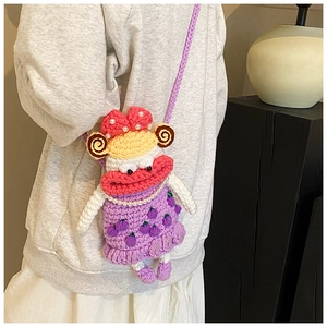 Handmade purple crochet crossbody bag with funny cartoon face and pearl necklace detail
