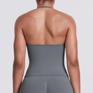 Rear view of dark grey seamless racerback yoga top and high-waist fitness leggings