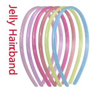 Close-up of translucent candy-colored plastic headbands with non-slip inner teeth design