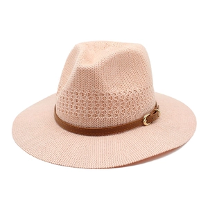 Elegant light pink woven straw hat with a brown leather belt buckle for women sun protection