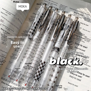 Close-up of six retractable gel pens with geometric patterns on a book background