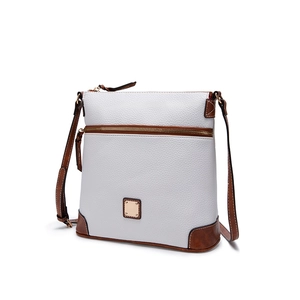 Detail view of white pebble leather crossbody bag with brown leather trim and gold zipper