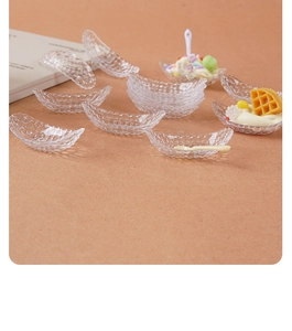 Detailed view of clear mini boat-shaped plastic bowls with wavy edges for DIY crafts