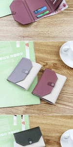 Three-fold leather wallet with contrast colors, daisy buckle, and multiple card slots