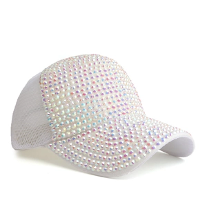 Detail of white mesh baseball cap featuring vibrant iridescent rhinestones and breathable back