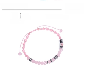 Detail of 6mm faceted pink crystal beads on adjustable woven Morse code bracelet