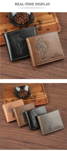 Detail of vintage men's wallet with embossed cowboy design on premium leather surface