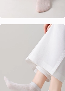 Close-up of white silk mesh socks showing breathable texture and ribbed cuffs for women