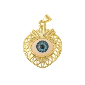 Golden heart pendant with a blue zircon evil eye charm on a clean white background
