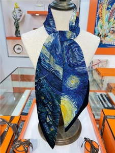 Detail of silk scarf with Van Gogh Starry Night print showing fine texture and deep blue tones