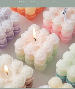 Close-up of pastel rose flower cluster scented candles with realistic petal textures