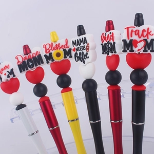 DIY silicone bead ballpoint pens for mothers in various colors displayed on a clear stand