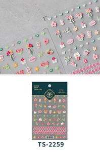 Détail de stickers 3D gaufrés pour ongles avec motifs tulipes, marguerites et fraises