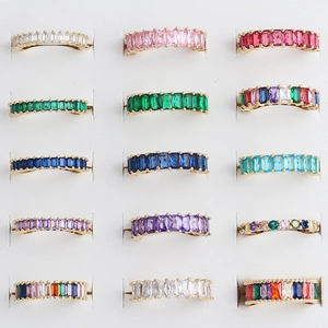 Detailed grid of adjustable rings featuring colorful baguette-cut cubic zirconia crystals