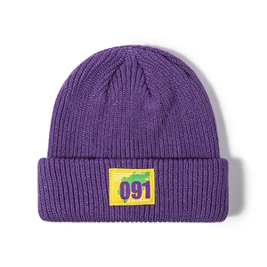 Deep purple ribbed knit beanie featuring a yellow embroidered 091 patch for street style