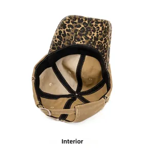 Detail of distressed baseball cap interior featuring leopard print brim and metal buckle