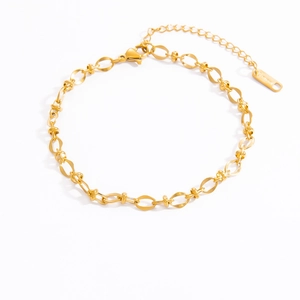 Detail shot of golden stainless steel chain link bracelet with lobster clasp and S.STEEL tag