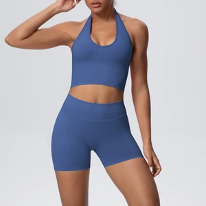 Detail of blue seamless ribbed fabric on halter neck sports bra and yoga shorts