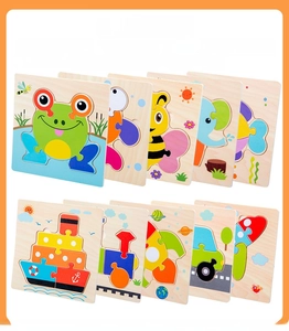 Macro view of wooden puzzles featuring colorful cartoon animals and vehicle shapes