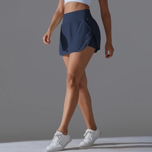 Detail view of the high-waisted navy blue tennis skort with functional side pockets