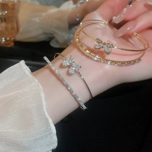 Sparkling double-row bow cuff bracelet set with cubic zirconia for women, gold and silver finish