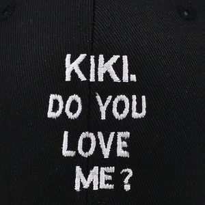 KIKI DO YOU LOVE ME? white embroidery on black cotton baseball cap fabric texture