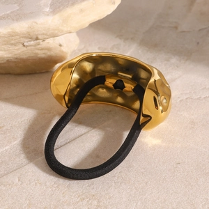 Chic hammered texture stainless steel hair tie with black elastic band on stone surface