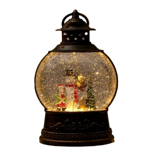 Vintage bronze Christmas lantern with LED light and miniature snowman festive scene