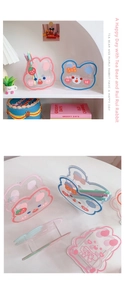 Detail of cartoon bear and rabbit acrylic desk organizer with transparent finish