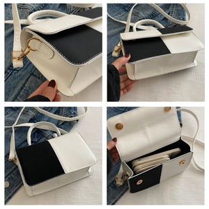 Dettagli della borsa a contrasto bianco e nero con hardware e capacità dell'interno