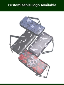 Macro view of long wallets featuring Gothic Halloween patterns and black wristlet straps