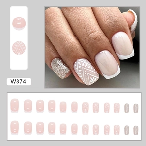 French tip press-on nails set with baroque white lace patterns and silver glitter accents