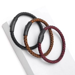 Three men's braided leather bracelets in black, brown, and burgundy with metal magnetic clasps