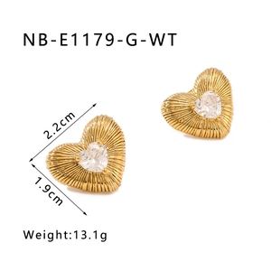 Detail view of gold heart earrings with 18k plating and 2.2cm size measurements
