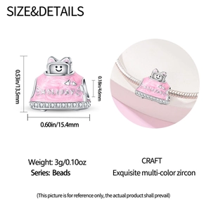 Detail of pink holiday luggage charm with 925 silver plating and white zircon inlay