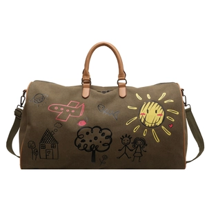 Large olive canvas travel bag with colorful graffiti prints and brown leather handles
