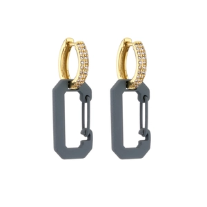Detail of grey geometric pin earrings with micro-inlaid cubic zirconia and gold plating