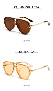 Detail view of aviator sunglasses in tortoiseshell and tea colors with gold metal temples