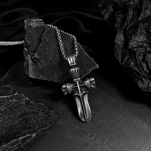 Gothic silver stainless steel cross skull pendant necklace for men on dark stone background