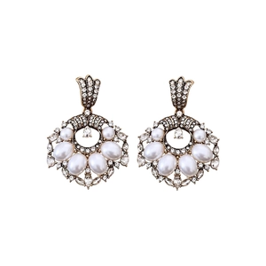 Vintage gold pearl drop earrings with sparkling rhinestones in an elegant retro style