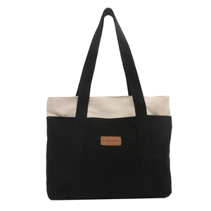 Large capacity canvas tote bag with black and white contrast design and leather patch
