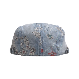 Detail of vintage denim ivy cap with floral print and adjustable metal buckle side