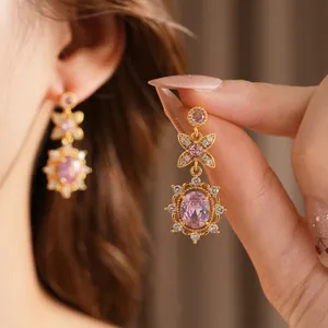 Vintage style gold earrings with pink oval zircon and delicate diamond flower details