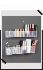 Macro shot of wall-mounted clear acrylic storage organizer with multiple compartments
