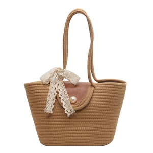 Straw woven tote bag with brown leather flap, pearl clasp and decorative lace ribbon