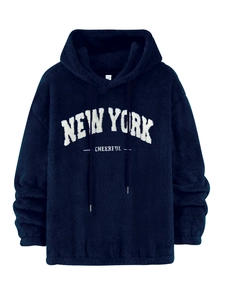 Detailed macro view of plush navy blue hoodie fabric with white towel embroidery