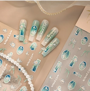 Detailed relief nail sticker with blue lotus design and elegant golden outlines