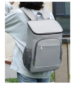 Outdoor thermal backpack in grey worn by model, ideal for camping and picnic use