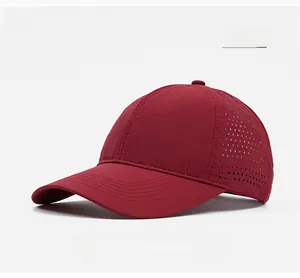 Detail of dark red breathable baseball cap featuring laser-cut side ventilation holes