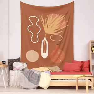Detailed view of bohemian tapestry with abstract orange and white botanical art